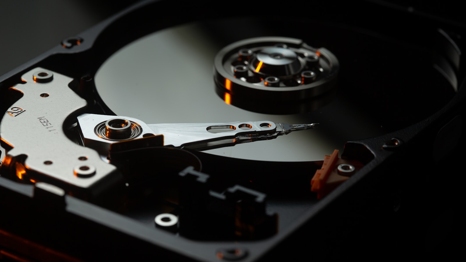 External hard drives and a laptop on a tidy home office desk