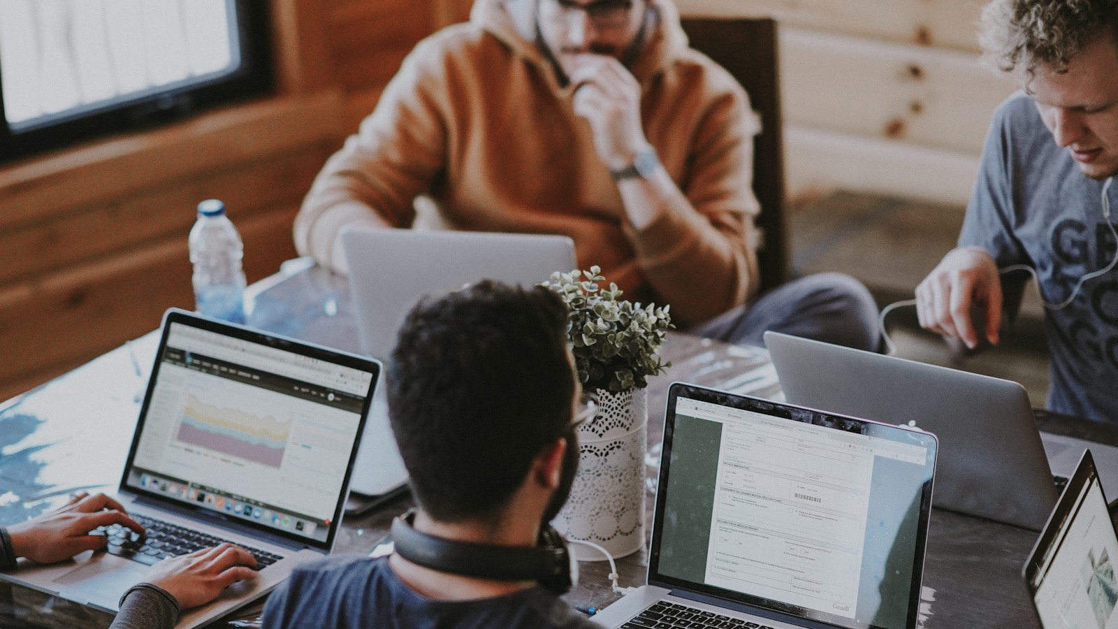 Two colleagues discussing feedback in a calm modern office setting